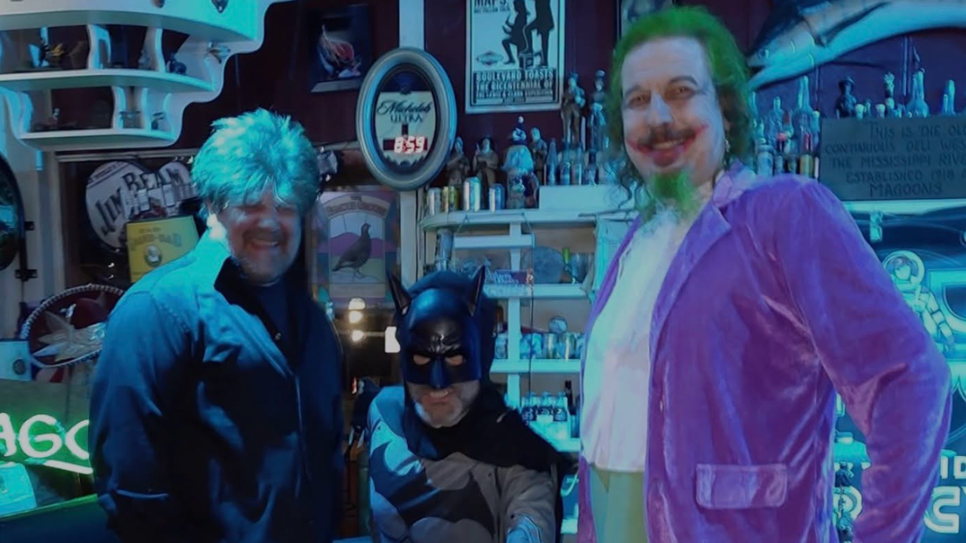 Three guests in Halloween costumes at Magoon's Famous Delicatessen promoting the JaMaZoN Cloud Halloween Costume Party on October 31.